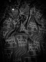 black polo shirt featuring a grey high voltage power connector image printed all over.