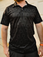 Black gearhead polo shirt featuring a subtle, all-over repeating pattern of Mazda rotary engine rotors.