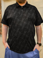 Black professional polo shirt featuring a subtle, all-over repeating pattern of coilover suspension shocks.