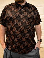 Black electric vehicle polo shirt featuring a repeating pattern of EV power connectors and high-voltage orange cables.